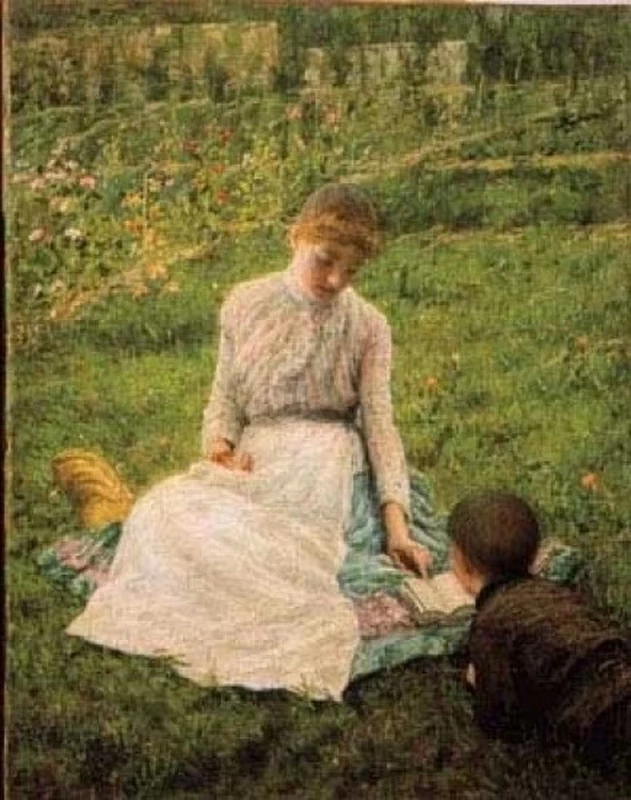 Madre con il figlio nel parco in lettura